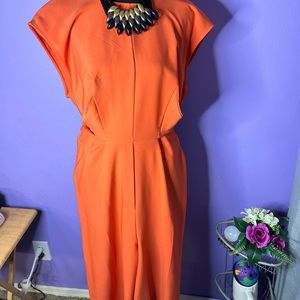Peach colored jump suit with sash